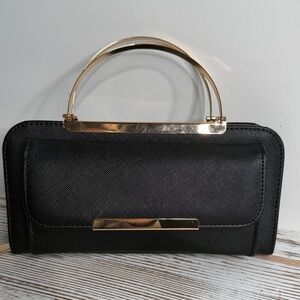 Elegant Black Handbag with Gold Accents